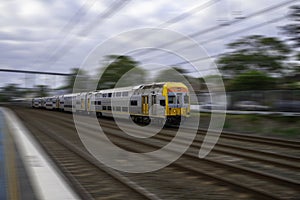 Speeding Passenger Train moving through Station in Sydney CBD NSW Australia