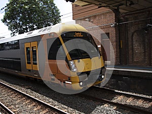 Speeding Passenger Train moving through Station in Sydney CBD NSW Australia