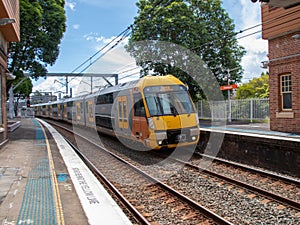 Speeding Passenger Train moving through Station in Sydney CBD NSW Australia