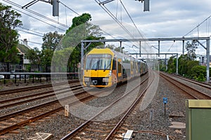 Speeding Passenger Train moving through Station in Sydney CBD NSW Australia