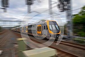 Speeding Passenger Train moving through Station in Sydney CBD NSW Australia