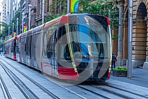 Speeding Passenger Tram Train moving through Station in Sydney CBD NSW Australia
