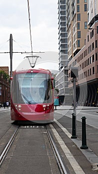 Speeding Passenger Tram Train moving through Station in Sydney CBD NSW Australia