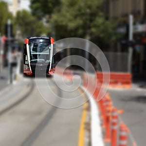 Speeding Passenger Tram Train moving through Station in Sydney CBD NSW Australia