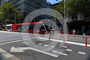 Speeding Passenger Tram Train moving through Station in Sydney CBD NSW Australia