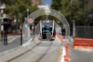 Speeding Passenger Tram Train moving through Station in Sydney CBD NSW Australia