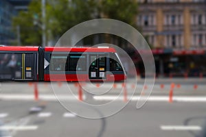 Speeding Passenger Tram Train moving through Station in Sydney CBD NSW Australia