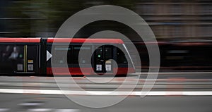 Speeding Passenger Tram Train moving through Station in Sydney CBD NSW Australia