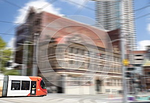 Speeding Passenger Tram Train moving through Station in Sydney CBD NSW Australia