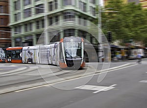 Speeding Passenger tram Train moving through Station in Sydney CBD NSW Australia
