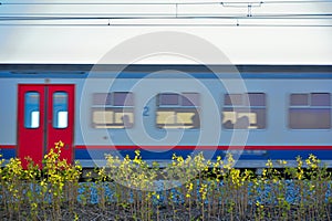 Speeding passing blurred train