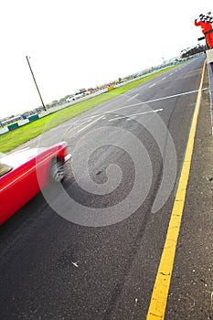 Speeding racer on racetrack