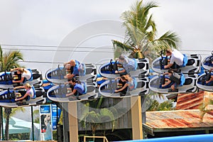 Speeding roller coaster ride in banked turn