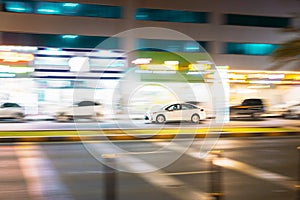 Speeding Taxi Car Fast Driving In City Street. Motion Blur Background