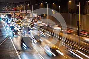 Speeding traffic on a city highway in Munich, Germany. Light trails from long exposure photography.