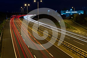 Speeding traffic driving along the M5 motorway at night.