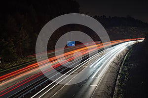 Speeding traffic on M40 motorway leaves light trails from fast moving cars.