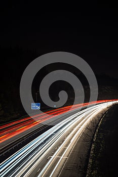 Speeding traffic on M40 motorway leaves light trails from fast moving cars.