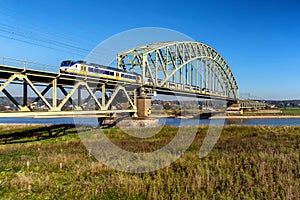 Speeding train crossing the Rhine river