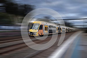 Speeding train nearing a Sydney train station in Sydney NSW Australia