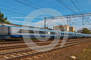 Speeding Train on suburban rails