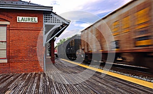 Speeding train and train station