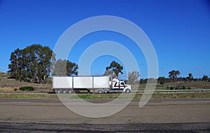 Speeding truck semi trailer on freeway in country town between Sydney and melbourne NSW Australia
