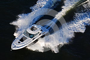 Speeding yacht at sunset