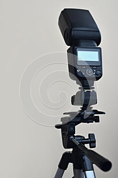 Speedlight gun with trigger set mounted on tripod