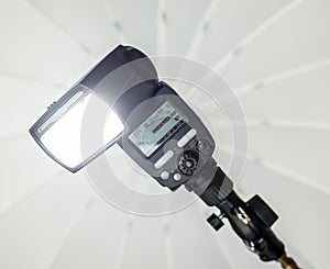 Speedlight with umbrella
