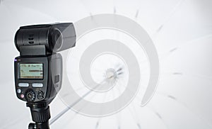 Speedlight with umbrella
