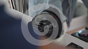 Speedometer and compass with dome cup on dashboard of tourist yacht