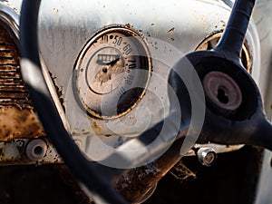 Speedometer and dashboard of an old wreck car left on a Namib de