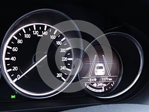 Speedometer and display of collision avoidance assist on car dashboard