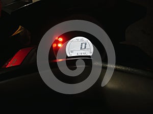 speedometer 0 km/h, indication of low petrol, hot engine and carburetor photo