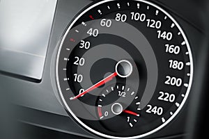 Speedometer on modern car dashboard, closeup