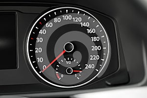 Speedometer on car dashboard, closeup view