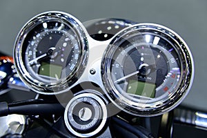 Speedometer on motorcycle dashboard background