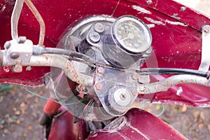 Speedometer of old red rusty motorcycle