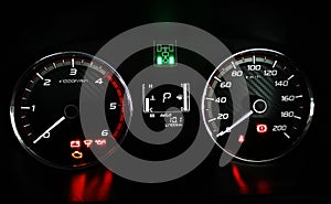 Speedometer and RPM gauge cluster of a Pickup Truck in 2 High Mode