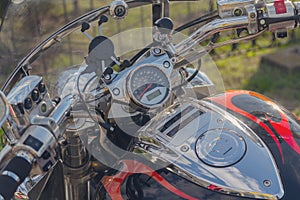 Speedometer, steering wheel and gas tank beautiful classic motorcycle
