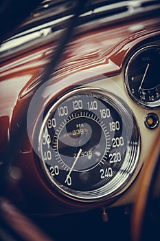 Speedometer on a vintage car`s dashboard