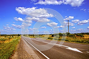 Speedway road through natural landscape in summer