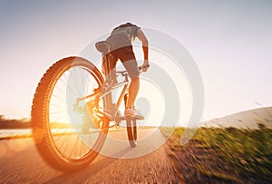 Speedy bicyclist on a sunny afternoon photo