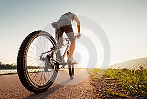 Speedy bicyclist wide angle shoot photo