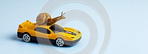 Speedy snail like car racer. Concept of speed and success. Concept of fast taxi or delivery. Yellow car blue background