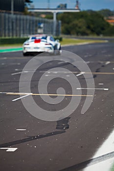 Speedy supercar on the road during the race created some drift on the asphalt