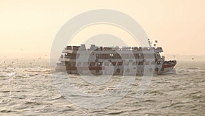 Speedy travel cruise ship dusk view . Travel Cruise ship deep sea behind running sea gull makes a charming natural view