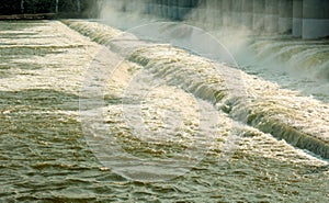 Speedy water and fog from the Grand aged dam of Kallanai constructed by king karikala chola with granite stone.