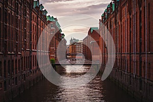 Speicherstadt warehouse district in Hamburg, Germany. Old brick buildings and channel of Hafencity quarter. UNESCO